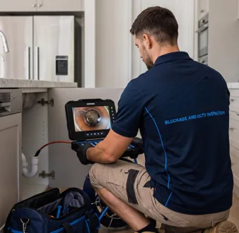 Clearing a blocked sink at a Wahroonga property